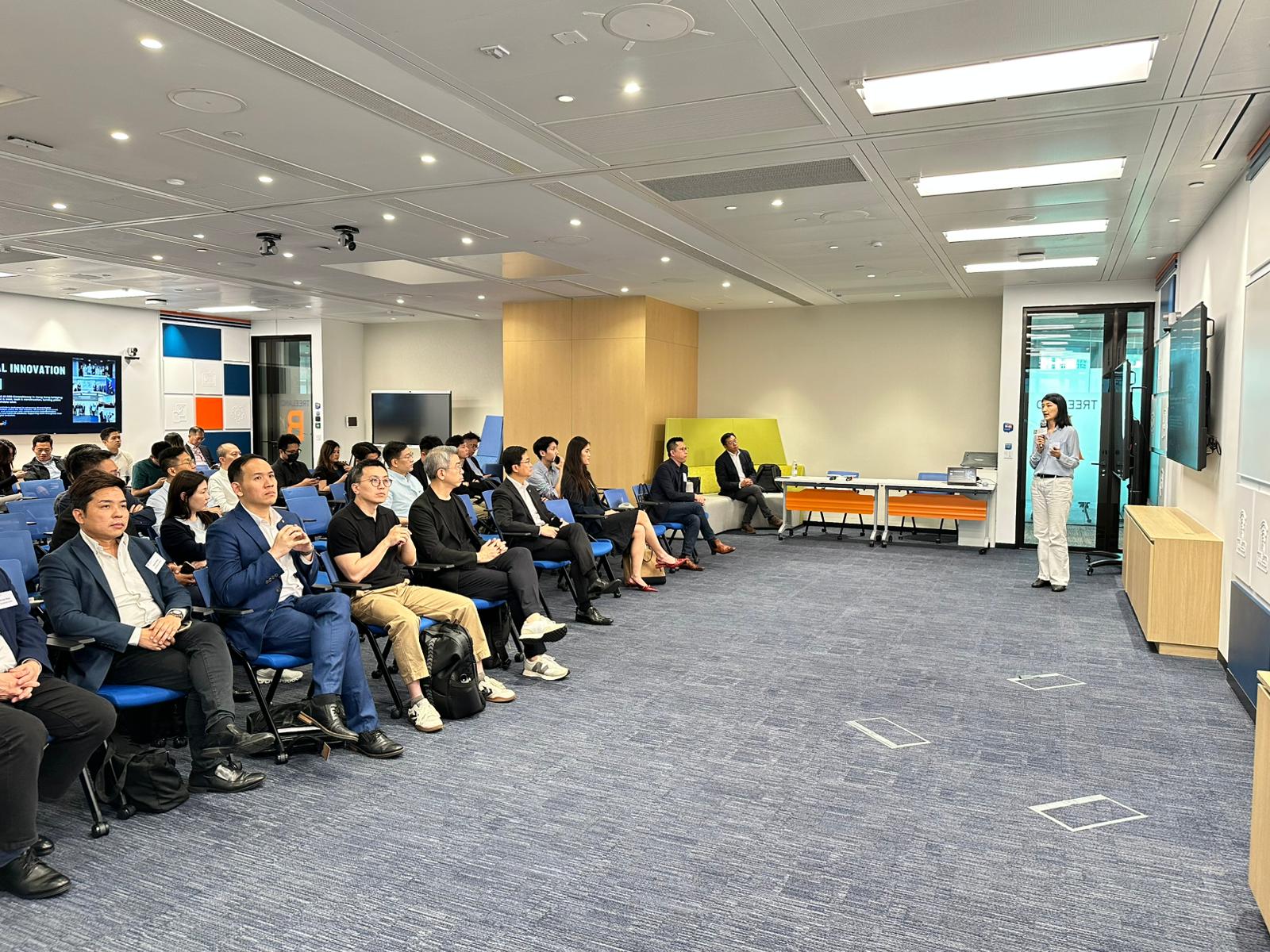 Adeline Chan presenting to a full audience at The Quayside